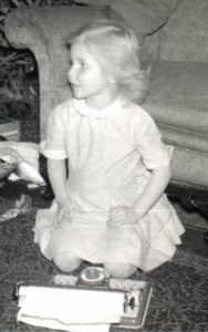Wendy age 6 at typewriter